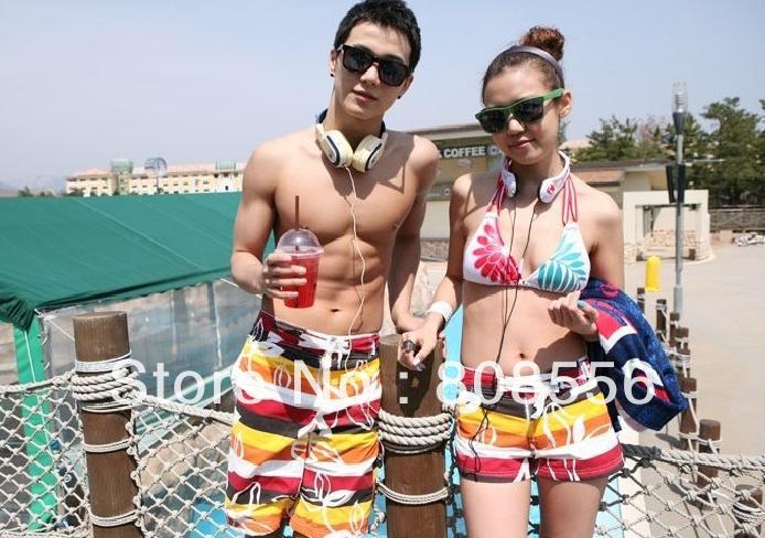 Free Shipping the price of two fire colored stripes couple beach pants women/men shorts of beach style trousers in stock