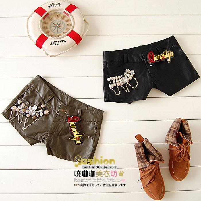 2011 juniors clothing button decoration PU shorts ,Free shipping.