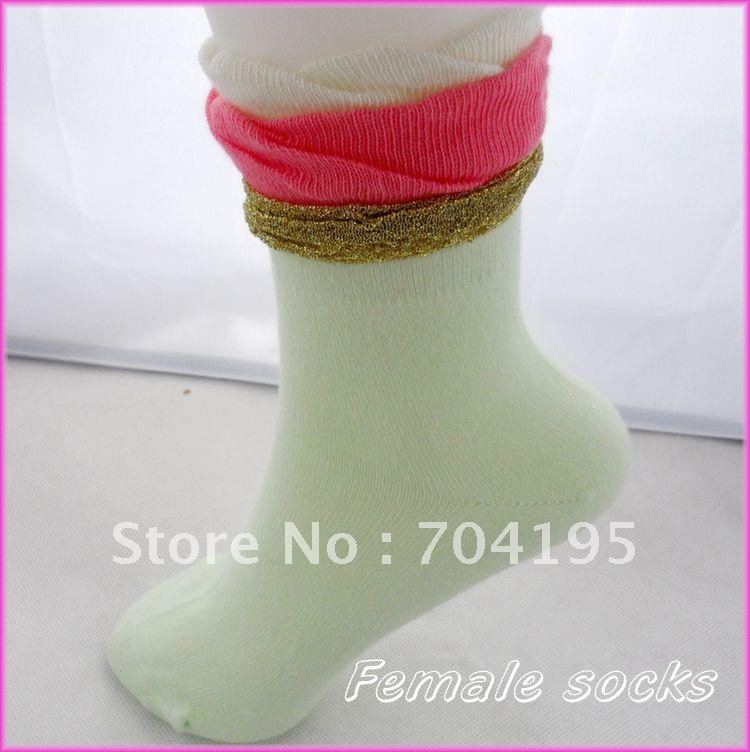 female knee-high socks  gold edge piles of socks